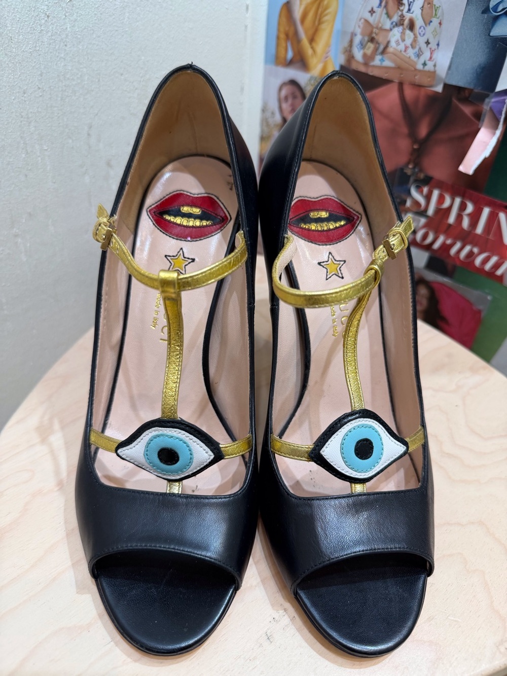 Gucci Black Leather Peep-Toe Heels with Gold Straps and Blue Eye Appliqués